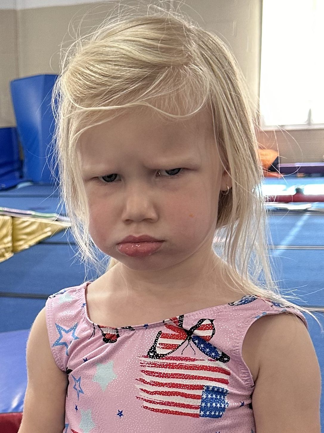 Asserting independence while pouting about being told what to do.